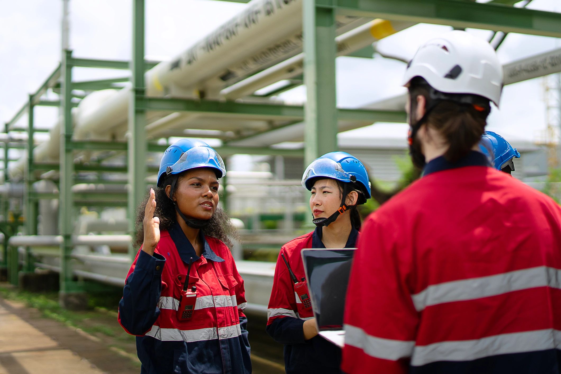 Engineering team reviewing work at an industrial site