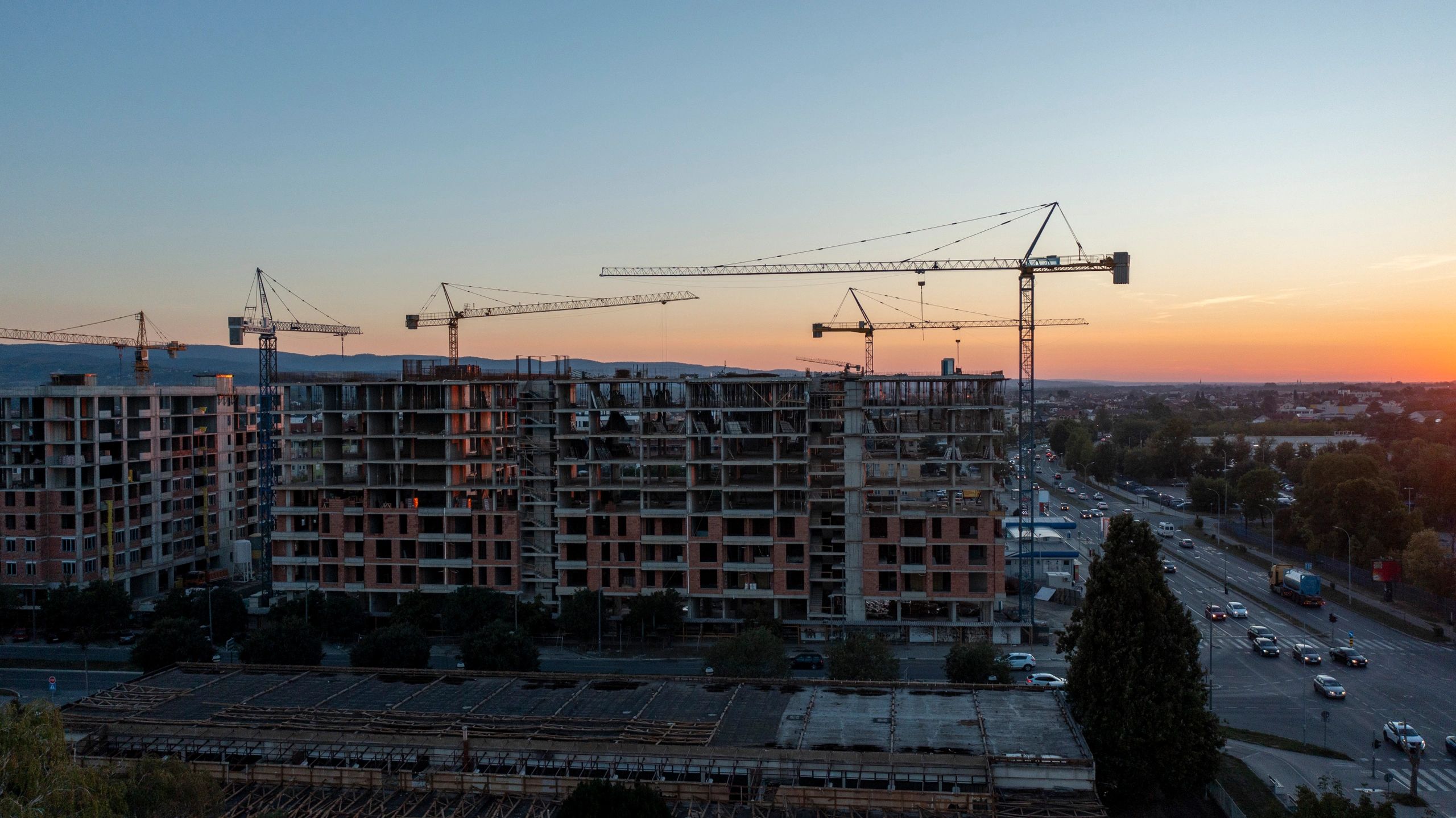 Urban construction site with cranes and active infrastructure development